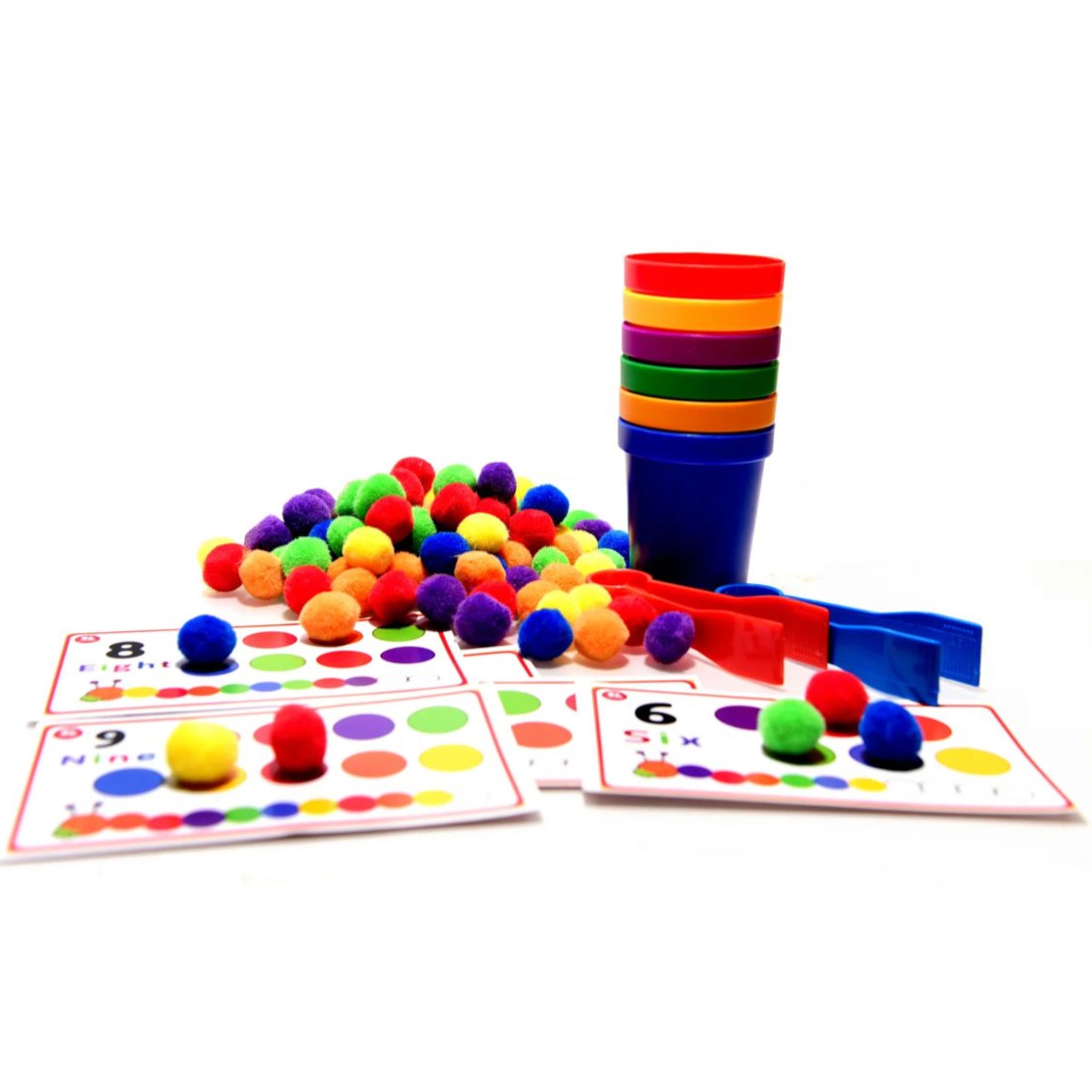 Toddler using tongs for fine motor skill development and color matching