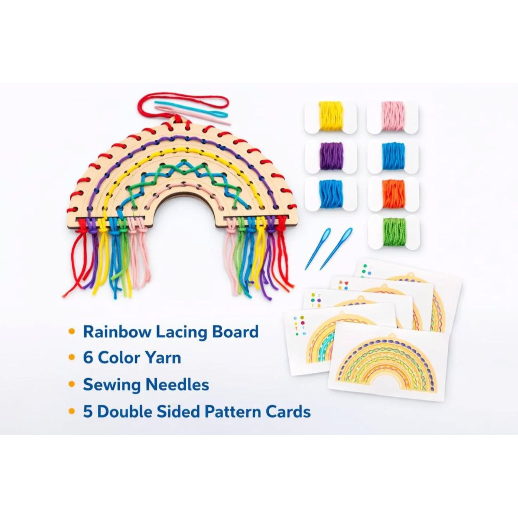 Rainbow lacing board with yarn, needles, and pattern cards on a white background